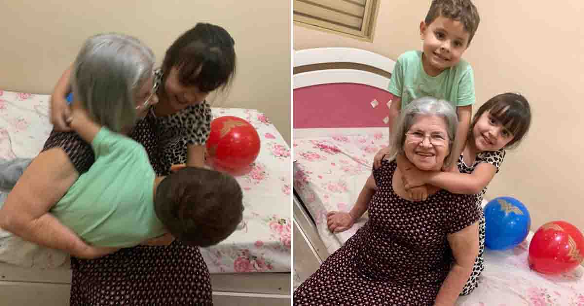 netos dão um abraço em sua avó numa cama
