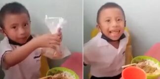 menino mostra para professora coxa de frango do almoço que guardou para a mãe dele