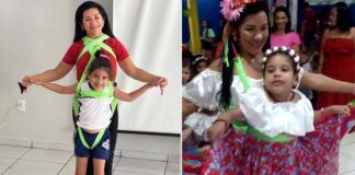 professora dança quadrilha com aluna deficiente presa em sua cintura